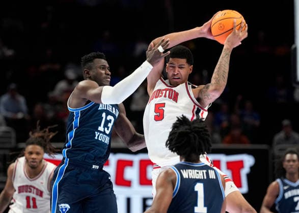 MAR 12 2026: Houston Cougars center Chris Cenac Jr. (5) grabs a pass while guarded by BYU Cougars center Keba Keita (13) in the Big 12 Championship Tournament at T-Mobile center, Kansas City, Missouri. CSM. NCAA, College League, USA Basketball 2026: BYU Vs Houston Big 12 Tournament  - ZUMAc04_ 20260312_zma_c04_225 Copyright: xJonxRobichaudx