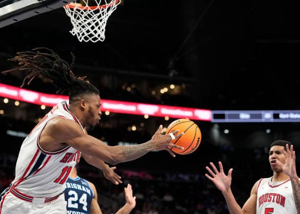 MAR 12 2026:Houston Cougars forward Joseph Tugler (11) makes a pass under the basket to Houston Cougars center Chris Cenac Jr. (5) against BYU in the Big 12 Championship Tournament at T-Mobile center, Kansas City, Missouri. CSM. NCAA, College League, USA Basketball 2026: BYU Vs Houston Big 12 Tournament  - ZUMAc04_ 20260312_zma_c04_233 Copyright: xJonxRobichaudx