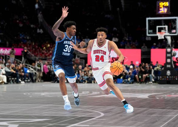 MAR 12 2026:Houston Cougars forward Chase McCarty (24) drives against BYU Cougars guard Kennard Davis Jr. (30) in the Big 12 Championship Tournament at T-Mobile center, Kansas City, Missouri. CSM. Kansas City United States - ZUMAc04_ 20260312_zma_c04_235 Copyright: xJonxRobichaudx
