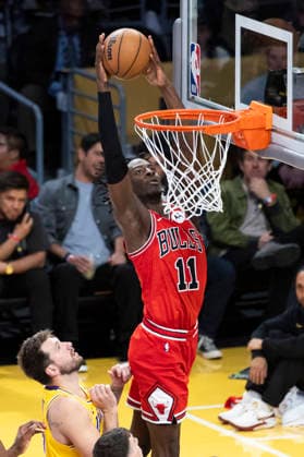 March 12, 2026, Los Angeles, California, USA: Chicago BullsÃ¢â‚¬â ¢ Leonard Miller (11) dunks against Los Angeles LakersÃ¢â‚¬â ¢ Luka DonÄÂiÄ¡ (77) during an NBA, Basketball Herren, USA basketball game at Crypto.com Arena on Thursday, March 12, 2026 in Los Angeles. NBA 2026: Bulls Vs Lakers  - ZUMAc68_ 20260312_zaf_c68_042 Copyright: xRingoxChiux