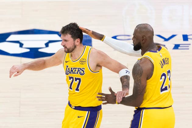 March 12, 2026, Los Angeles, California, USA: Los Angeles LakersÃ¢â‚¬â ¢ Luka DonÄÂiÄ¡ (77) celebrates with LeBron James (23) after hitting a 3-point shot against the Chicago Bulls during an NBA, Basketball Herren, USA basketball game at Crypto.com Arena on Thursday, March 12, 2026 in Los Angeles. NBA 2026: Bulls Vs Lakers  - ZUMAc68_ 20260312_zaf_c68_065 Copyright: xRingoxChiux
