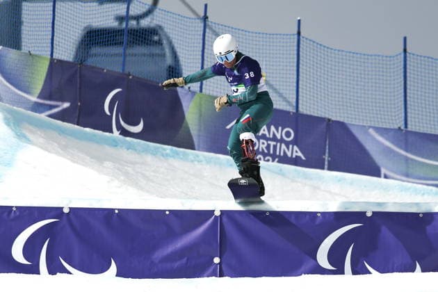ITALY, CORTINA D AMPEZZO - MARCH 13, 2026: Dmitry Fadeyev of Russia competes in the men s banked slalom SB-LL1 final during the 2026 Winter Paralympic Games at the Tofane Alpine Skiing Centre. Mikhail Tereshchenko TASS  89965140