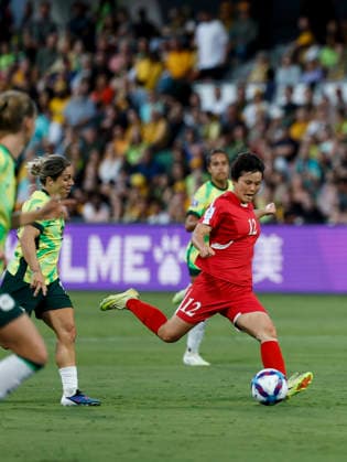 (260313) -- PERTH, March 13, 2026 -- Hong Song Ok (1st R) of DPRK competes during the quarterfinal of Women s Asian Cup between Australia and the Democratic People s Republic of Korea (DPRK) at Perth Rectangular Stadium in Perth, Australia, March 13, 2026. ) (SP)AUSTRALIA-PERTH-FOOTBALL-WOMEN S ASIAN CUP-QUARTERFINALS-AUS VS PRK MaxPing 