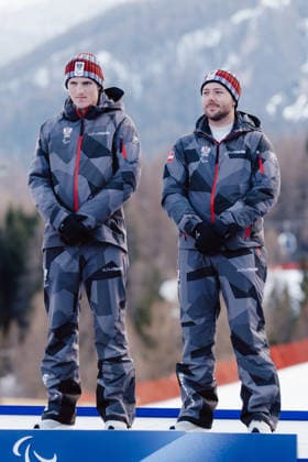 PARALYMPICS - Winter Paralympics Milano Cortina 2026 CORTINA D AMPEZZO,ITALY,13.MAR.26 - PARALYMPICS, ALPINE SKIING - Paralympic Winter games, Winterspiele,Spiele, Summer games Milano Cortina 2026, giant slalom, men, medal ceremony. Image shows Johannes Aigner and guide Nico Haberl (AUT).  GEPAxpictures xMatthiasxTrinkl