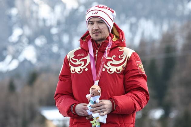 ITALY, VENETO - MARCH 13, 2026: Bronze medallist Aleksei Bugaev of Russia during the victory ceremony for the men s para alpine skiing giant slalom standing event at Tofane Alpine Skiing Centre during the 2026 Winter Paralympic Games, in Cortina d Ampezzo, Province of Belluno 2026 Winter Paralympics: Para Alpine Skiing  - ZUMAt113 20260313_zaa_t113_284 Copyright: xMikhailxTereshchenkox