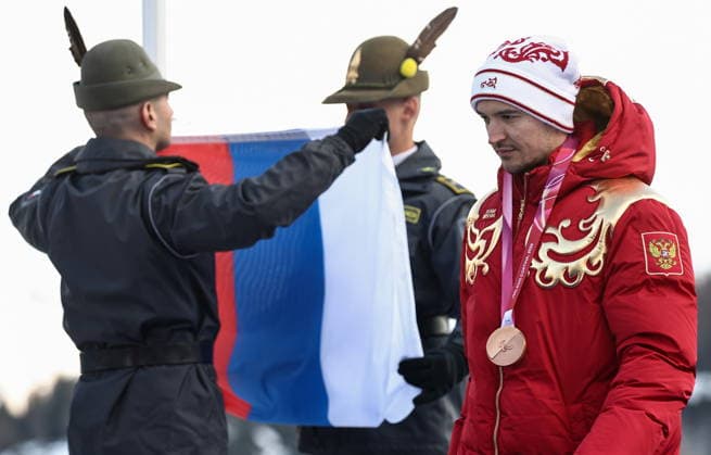 ITALY, VENETO - MARCH 13, 2026: Bronze medallist Aleksei Bugaev of Russia (R) during the victory ceremony for the men s para alpine skiing giant slalom standing event at Tofane Alpine Skiing Centre during the 2026 Winter Paralympic Games, in Cortina d Ampezzo, Province of Belluno 2026 Winter Paralympics: Para Alpine Skiing  - ZUMAt113 20260313_zaa_t113_294 Copyright: xMikhailxTereshchenkox