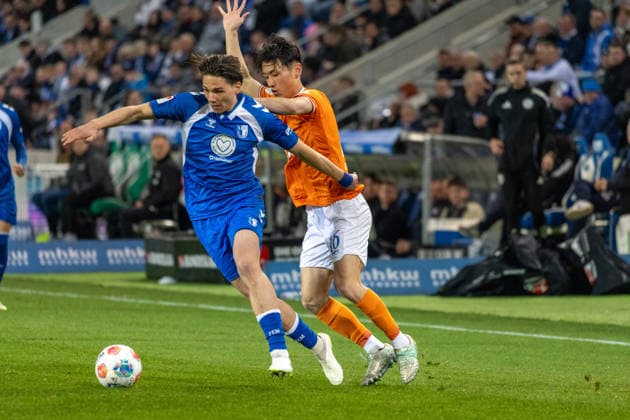 Germany, 2 Bundesliga, Season 2025 2026, Matchday 26, Avnet Arena, 1 FC Magdeburg vs SV Darmstadt 98, Stalmach Dariusz 1 FC Magdeburg, 6 , in duel against Akiyama Hiroki SV Darmstadt 98, 16 Copyright: xMichellexLukax