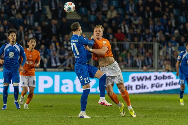 Germany, 2 Bundesliga, Season 2025 2026, Matchday 26, Avnet Arena, 1 FC Magdeburg vs SV Darmstadt 98, Michel Falko 1 FC Magdeburg, 21 in header duel against Lidberg Isac SV Darmstadt 98, 7 Copyright: xMichellexLukax