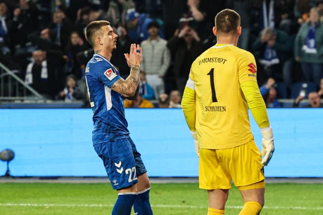 Mateusz Zukowski 1 FC Magdeburg,22 and goalkeeper Marcel Schuhen SV Darmstadt 98,1 2 Soccer Bundesliga season 2025 2026 1 FC Magdeburg vs SV Darmstadt 98 at the Avnet Arena in Magdeburg action,soccer,man,men,Germany,13 03 2026