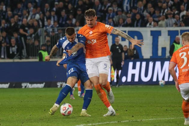 13 03 2026, xgox, Fußball 2 Bundesliga, 1 FC Magdeburg SV Darsmtadt 98 emspor, v l Mateusz Zukowski Magdeburg, 22 , Matej Maglica Darmstadt, 5 Zweikampf, Duell, Kampf, tackle DFL DFB REGULATIONS PROHIBIT ANY USE OF PHOTOGRAPHS as IMAGE SEQUENCES and or QUASI VIDEO Magdeburg