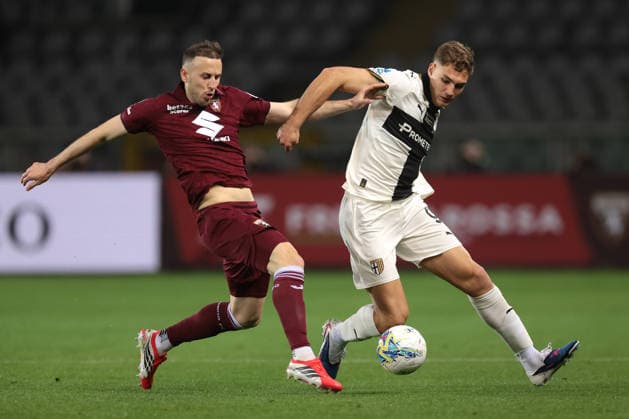 Turin, Italy, 13th March 2026. Ardian Ismajli of Torino FC challenges Mateo Pellegrino of Parma Calcio during the Torino vs Parma Serie A match at Stadio Grande Torino, Turin. Picture credit should read: Jonathan Moscrop Sportimage EDITORIAL USE ONLY. No use with unauthorised audio, video, data, fixture lists, club league logos or live services. Online in-match use limited to 120 images, no video emulation. No use in betting, games or single club league player publications. SPI_009_JM_TORO_PARMA SPI-4613-0009