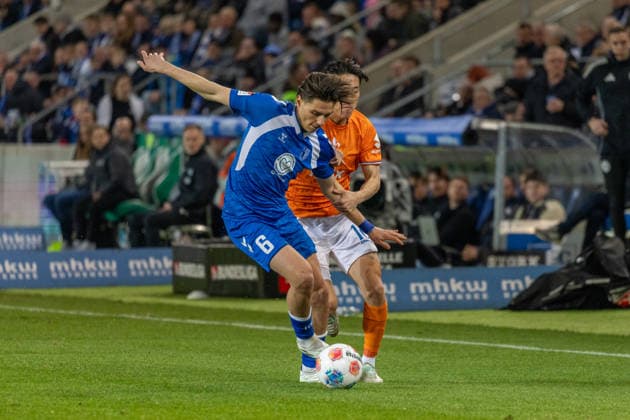 Germany, 2 Bundesliga, Season 2025 2026, Matchday 26, Avnet Arena, 1 FC Magdeburg vs SV Darmstadt 98, Stalmach Dariusz 1 FC Magdeburg, 6 in duel against Akiyama Hiroki SV Darmstadt 98, 16 Copyright: xMichellexLukax