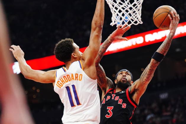 March 13, 2026, Toronto, On, Canada: Toronto Raptors Brandon Ingram (3) shoots past Phoenix Suns Oso Ighodaro (11) during first half NBA, Basketball Herren, USA basketball action in Toronto on Friday, March 13, 2026. Canada News - March 13, 2026  - ZUMAc35_ 20260313_zaf_c35_121 Copyright: xFrankxGunnx