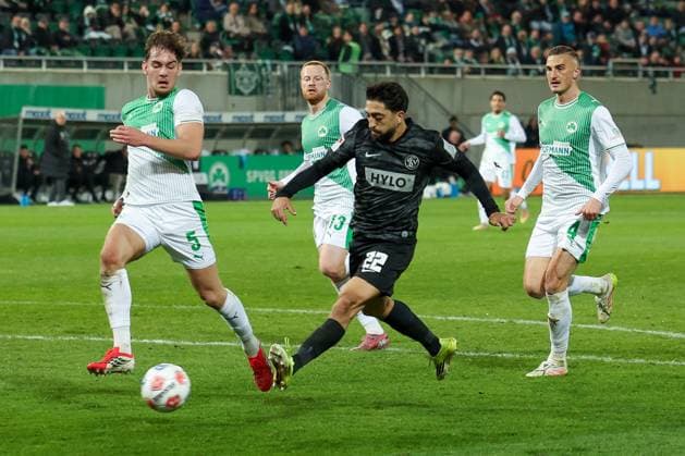 Immanuel Pherai 22 SV Elversberg pulls away, against Jannik Dehm 23 Spvgg Greuther Fuerth , and Philipp Ziereis 4 Spvgg Greuther Fuerth , Spvgg Greuther Fuerth vs SV Elversberg Football, Men, 2 Bundesliga, Season 2025 2026, Second round, Matchday 26, 13 03 2026 DFB regulations prohibit any use of photographs as image sequences and or quasi video Fuerth Bayern Germany Copyright: xkolbert-press MartinxAgüerax