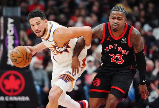 March 13, 2026, Toronto, On, Canada: Phoenix Suns Devin Booker (left) drives past Toronto Raptors Jamal Shead (23) during second half NBA, Basketball Herren, USA basketball action in Toronto on Friday, March 13, 2026. Canada News - March 13, 2026  - ZUMAc35_ 20260313_zaf_c35_129 Copyright: xFrankxGunnx