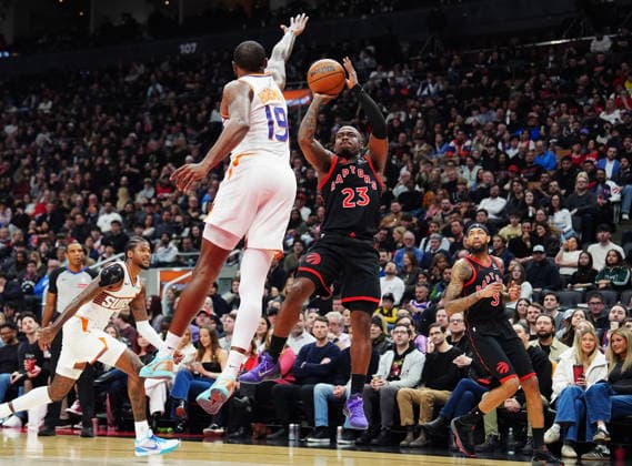 March 13, 2026, Toronto, On, Canada: Raptors guard Jamal Shead (23) shoots over Phoenix Suns forward Haywood Highsmith (19) during NBA, Basketball Herren, USA action in Toronto on March 13, 2026. Canada News - March 13, 2026  - ZUMAc35_ 20260313_zaf_c35_135 Copyright: xFrankxGunnx
