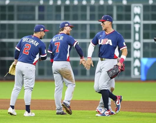 World Baseball Classic: U.S. vs. Canada United States players (from R) Aaron Judge, Bobby Witt Jr. and Alex Bregman celebrate after beating Canada in a World Baseball Classic quarterfinal game at Daikin Park in Houston, Texas, on March 13, 2026.  A14AA0005381919P
