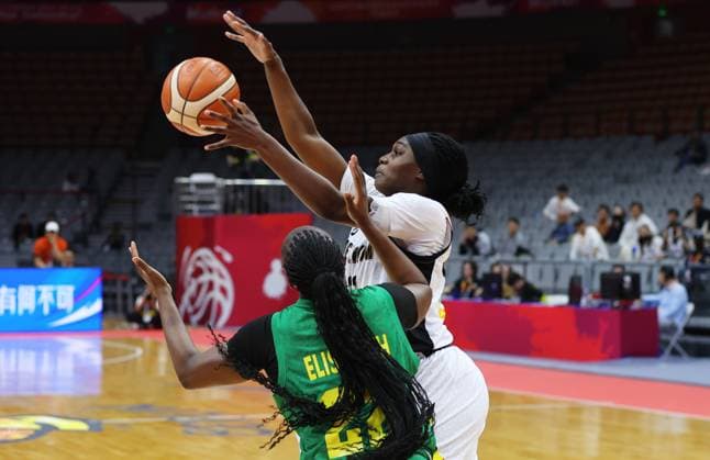 Mali sKamite Elisabeth Dabou and Belgium s Bethy Mununga fight for the ball during a basket game between Belgium s national team, Nationalteam Belgian Cats and Mali, in Wuhan, China, on Saturday 14 March 2026, the third game (out of 5) of the qualifications phase for the World Cup Basket tournament. NIKOLAxKRSTIC  x167430139x