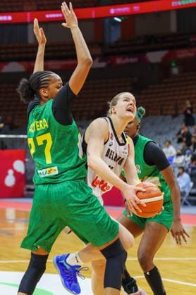 Mali s Diana Balaera and Belgium s Becky Massey fight for the ball during a basket game between Belgium s national team, Nationalteam Belgian Cats and Mali, in Wuhan, China, on Saturday 14 March 2026, the third game (out of 5) of the qualifications phase for the World Cup Basket tournament. NIKOLAxKRSTIC  x167430241x