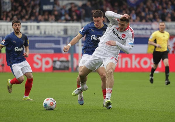 Luka Lochoshvili 1 FC Nuernberg , Adrian Kapralik Holstein Kiel Football, Men, Season 2025 2026, 2 BL, Holstein Stadion, Holstein Kiel vs 1 FC Nuernberg DFL REGULATIONS PROHIBIT ANY USE OF PHOTOGRAPHS AS IMAGE SEQUENCES AND OR QUASI VIDEO