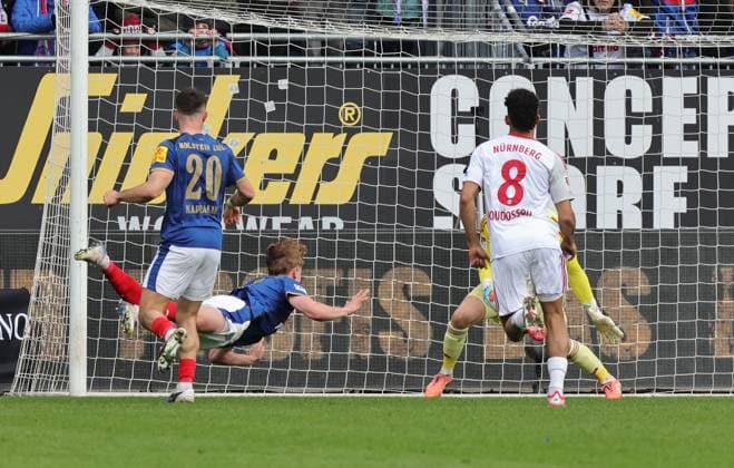 14 03 2026 Soccer Season 2025 2026 2 Soccer Bundesliga 26 Matchday Holstein Kiel KSV Kieler Sportvereinigung Holstein von 1900 Störche 1 FC Nürnberg FCN Club Sportfoto Zink DaMa xdaxmax DFL regulations prohibit any use of photographs as image sequences and or quasi video only for editorial use Tor Treffer Torschuß zum 2 2 Torschütze Kasper Davidsen 15, Holstein Kiel vs Jan Reichert 1, 1 FC Nürnberg FCN