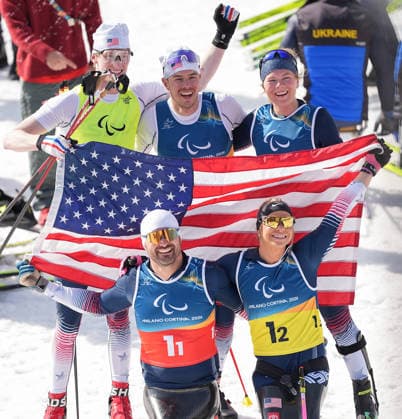 (260314) -- TESERO, March 14, 2026 -- Team the United States celebrate after winning the para cross-country skiing mixed 4x2.5km relay at the Milan-Cortina 2026 Paralympic Winter games, Winterspiele,Spiele, Summer games in Tesero, Italy, March 14, 2026. ) (SP)ITALY-TESERO-PARALYMPIC WINTER GAMES-PARA CROSS-COUNTRY SKIING-MIXED 4X2.5KM RELAY HouxZhaokang 