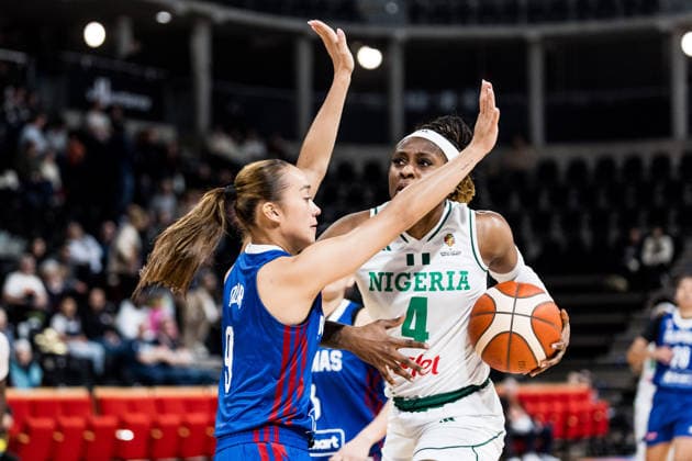 LYON-VILLEURBANNE, FRANCE - MARCH 14: Elizabeth Balogun (Nigeria, 4) controls the ball against Louna Ozar (Philippines, 9) during the FIBA Women™s World Cup Qualifying Tournament match between Nigeria (NGR) vs. Philippines (PHI) at Astroballe on matchday 3 of the FIBA Women™s World Cup Qualifying Tournament on March 14, 2026 in Lyon-Villeurbanne, France. France Copyright: xSteffiexWunderlx