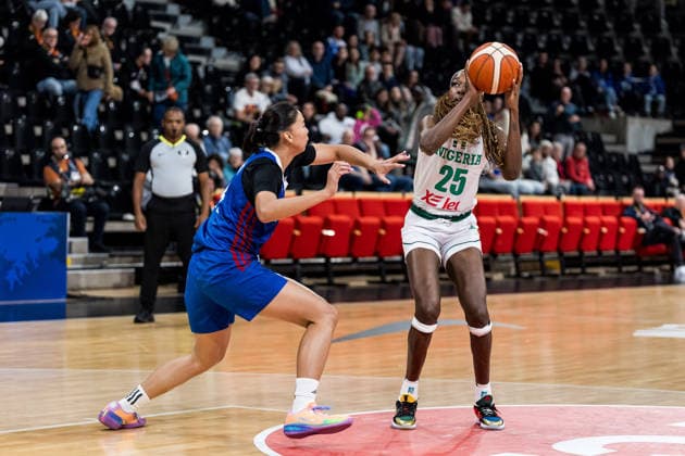 LYON-VILLEURBANNE, FRANCE - MARCH 14: Victoria Macaulay (Nigeria, 25) controls the ball against Kacey Dela Rosa (Philippines, 28) during the FIBA Women™s World Cup Qualifying Tournament match between Nigeria (NGR) vs. Philippines (PHI) at Astroballe on matchday 3 of the FIBA Women™s World Cup Qualifying Tournament on March 14, 2026 in Lyon-Villeurbanne, France. France Copyright: xSteffiexWunderlx
