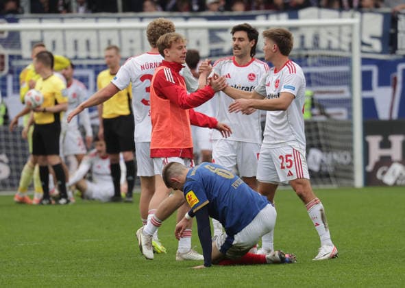 Joy for Fin Ole Becker 1 FC Nuernberg and his team, Marko Ivezic Holstein Kiel disappointed at the ground Football, Men, Season 2025 2026, 2 BL, Holstein Stadion, Holstein Kiel vs 1 FC Nuernberg, 2 3 DFL REGULATIONS PROHIBIT ANY USE OF PHOTOGRAPHS AS IMAGE SEQUENCES AND OR QUASI VIDEO