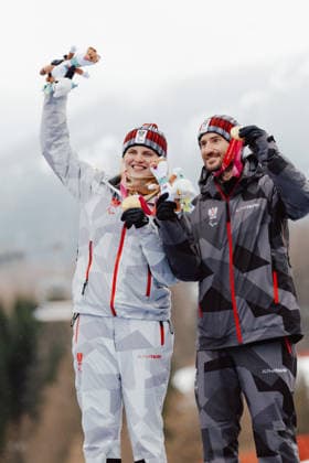 PARALYMPICS - Winter Paralympics Milano Cortina 2026 CORTINA D AMPEZZO,ITALY,14.MAR.26 - PARALYMPICS, ALPINE SKIING - Paralympic Winter games, Winterspiele,Spiele, Summer games Milano Cortina 2026, slalom, women, medal ceremony. Image shows Veronika Aigner and guide Eric Digruber (AUT).  GEPAxpictures xMatthiasxTrinkl
