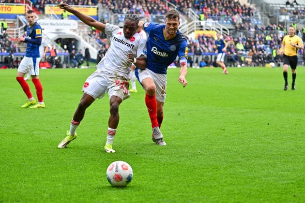 14 03 2026, Soccer, Men, 2 BL Bundesliga , Season 2025 2026, Holstein Kiel 1 FC Nürnberg, Matchday 26 Jonas Meffert vs Mohamed Ali Zoma Kiel, Holstein Stadion Holstein Stadion Schleswig Holstein Germany