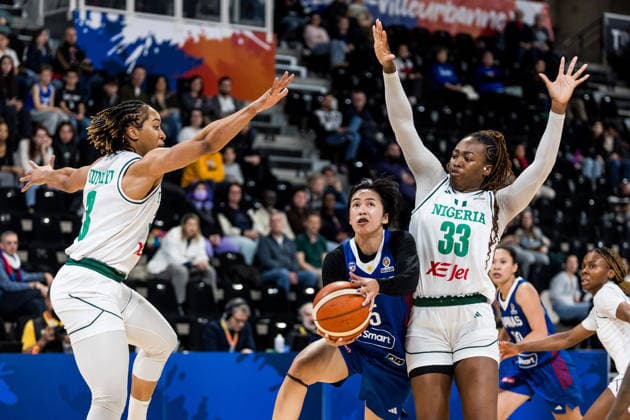 LYON-VILLEURBANNE, FRANCE - MARCH 14: Kent Jane Pastrana (Philippines, 5) controls the ball against Pallas Kunaiyi-Akpanah (Nigeria, 3) and Nicole Enabosi (Nigeria, 33) during the FIBA Women™s World Cup Qualifying Tournament match between Nigeria (NGR) vs. Philippines (PHI) at Astroballe on matchday 3 of the FIBA Women™s World Cup Qualifying Tournament on March 14, 2026 in Lyon-Villeurbanne, France. France Copyright: xSteffiexWunderlx