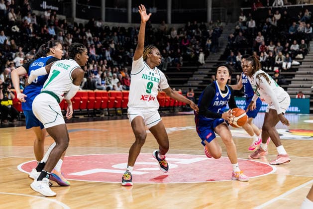 LYON-VILLEURBANNE, FRANCE - MARCH 14: Kent Jane Pastrana (Philippines, 5) controls the ball against Ifunanya Okoro (Nigeria, 9) during the FIBA Women™s World Cup Qualifying Tournament match between Nigeria (NGR) vs. Philippines (PHI) at Astroballe on matchday 3 of the FIBA Women™s World Cup Qualifying Tournament on March 14, 2026 in Lyon-Villeurbanne, France. France Copyright: xSteffiexWunderlx