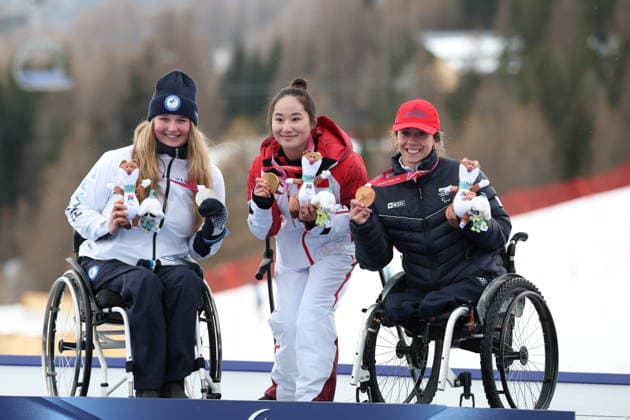 March 14, 2026, Milan, Lombardy, Italy: Nette Kiviranta of Finland, Wenjing Zhang of China and Audrey Pascual Seco of Spain on the podium in Alpine .Sit Ski Slalom event at Tofane Skiing Center, at the Paralympic games in Cortina. Milan Italy - ZUMAg209 20260314_oly_g209_300 Copyright: xJonxGaedex