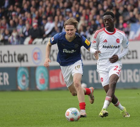 Jonas Therkelsen Holstein Kiel , Rabba Nzingoula 1 FC Nuernberg Football, Men, Season 2025 2026, 2 BL, Holstein Stadion, Holstein Kiel vs 1 FC Nuernberg, 2 3 DFL REGULATIONS PROHIBIT ANY USE OF PHOTOGRAPHS AS IMAGE SEQUENCES AND OR QUASI VIDEO