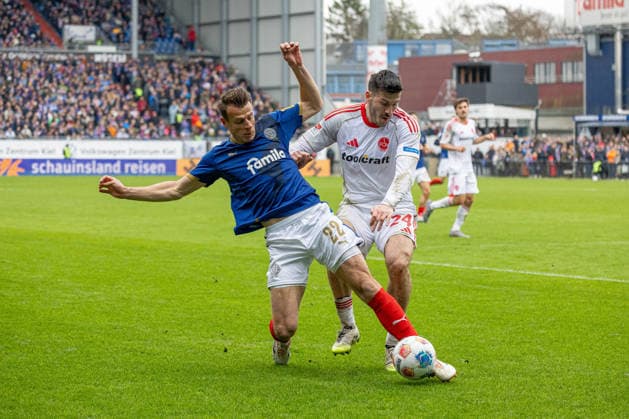 14 03 2026 Soccer 2 Bundesliga Men Season 2025 2026 26 Matchday KSV Holstein Kiel 1 FC Nürnberg Kiel in blue, Nürnberg in white Stefan Schwab li , Luka Lochosvili Kiel Holstein Stadion, Westring 501 Schleswig Holstein Germany