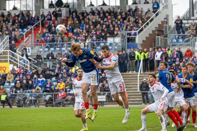 14 03 2026 Soccer 2 Bundesliga Men Season 2025 2026 26 Matchday KSV Holstein Kiel 1 FC Nuremberg Kiel in blue, Nuremberg in white Header duel between Lasse Rosenboom left and Adam Markhiyev Kiel Holstein Stadium, Westring 501 Schleswig Holstein Germany