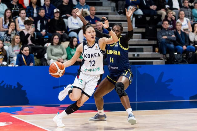 LYON-VILLEURBANNE, FRANCE - MARCH 14: Haeran Lee (Republic of Korea, 12) controls the ball against Marlyn Vente (Colombia, 14) during the FIBA Women™s World Cup Qualifying Tournament match between Republic of Korea (KOR) vs. Colombia (COL) at Astroballe on matchday 3 of the FIBA Women™s World Cup Qualifying Tournament on March 14, 2026 in Lyon-Villeurbanne, France. France Copyright: xSteffiexWunderlx