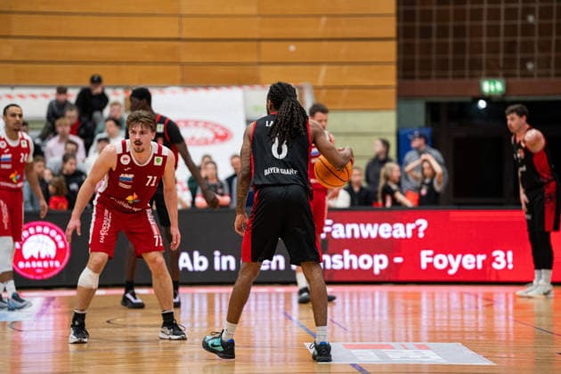 Paderborn Baskets GER vs Bayer Giants Leverkusen GER , Basketball, Barmer 2 Basketball Bundesliga Pro A, 27 Matchday, 14 3 2026, Season 2025 2026, Paderborn Kobe Langley Bayer Giants Leverkusen, 08 dribbling, against Jonathan Klussmann Paderborn Baskets, 71 Paderborn Sportzentrum Maspernplatz Germany