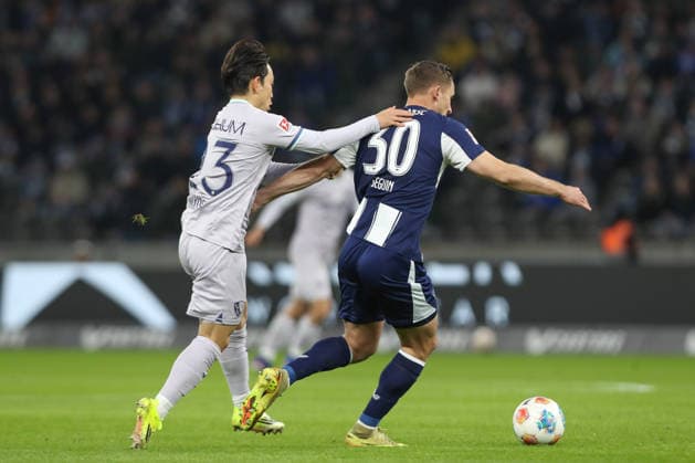 14 03 2026, xtgx, Soccer 2 Bundesliga Hertha BSC Berlin VfL Bochum emspor, v l Koji Miyoshi Bochum, 23 , Paul Seguin Hertha, 30 duel, duel, fight, tackle DFL DFB REGULATIONS PROHIBIT ANY USE OF PHOTOGRAPHS as IMAGE SEQUENCES and or QUASI VIDEO Berlin