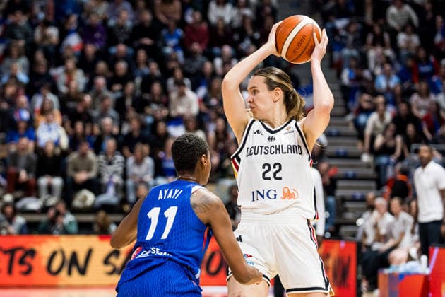 LYON-VILLEURBANNE, FRANCE - MARCH 14: Emily Bessoir (Germany, 22) controls the ball against Valeriane Ayayi (France, 11) during the FIBA Women™s World Cup Qualifying Tournament match between Germany (GER) vs. France (FRA) at Astroballe on matchday 3 of the FIBA Women™s World Cup Qualifying Tournament on March 14, 2026 in Lyon-Villeurbanne, France. France Copyright: xSteffiexWunderlx