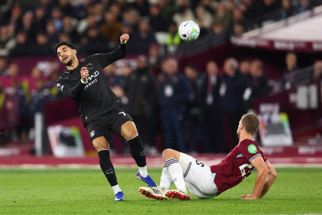 London, England, 14th March 2026. Omar Marmoush of Manchester City is challenged by Tomas Soucek of West Ham United during the West Ham United vs Manchester City Premier League match at the London Stadium, London. Picture credit should read: Paul Terry Sportimage EDITORIAL USE ONLY. No use with unauthorised audio, video, data, fixture lists, club league logos or live services. Online in-match use limited to 120 images, no video emulation. No use in betting, games or single club league player publications. SPI_013_PT_West_Ham_Man_City SPI-4602-0014