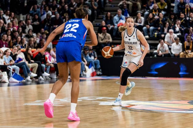 LYON-VILLEURBANNE, FRANCE - MARCH 14: Emily Bessoir (Germany, 22) controls the ball against Marieme Badiane (France, 22) during the FIBA Women™s World Cup Qualifying Tournament match between Germany (GER) vs. France (FRA) at Astroballe on matchday 3 of the FIBA Women™s World Cup Qualifying Tournament on March 14, 2026 in Lyon-Villeurbanne, France. France Copyright: xSteffiexWunderlx