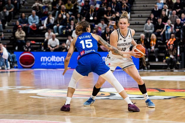 LYON-VILLEURBANNE, FRANCE - MARCH 14: Leonie Fiebich (Germany, 13) controls the ball against Gabby Williams (France, 15) during the FIBA Women™s World Cup Qualifying Tournament match between Germany (GER) vs. France (FRA) at Astroballe on matchday 3 of the FIBA Women™s World Cup Qualifying Tournament on March 14, 2026 in Lyon-Villeurbanne, France. France Copyright: xSteffiexWunderlx