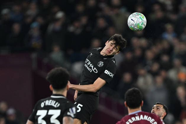 West Ham United v Manchester City, Premier League Manchester City defender Abdukodir Khusanov (45) heads the ball during the Premier League match between West Ham United and Manchester City at the London Stadium, London, UK on 14 March 2026. London London Stadium UK Editorial use only DataCo restrictions apply See www.football-dataco.com , Copyright: xSimonxTraylenx PSI-23900-0046