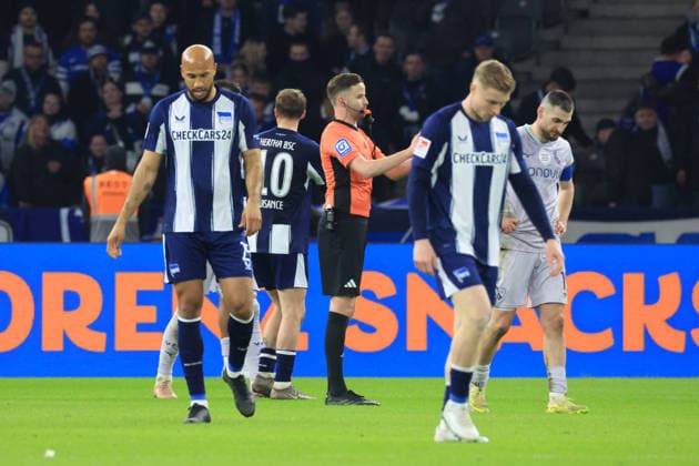 DEU, DFL, 2 FBL, Hertha BSC vs VfL Bochum, 14 03 2026, Berliner Olympiastadion, Berlin, DEU, DFL, 2 FBL, Hertha BSC vs VfL Bochum, im Bild John Anthony Brooks Hertha BSC Berlin 25 , h2 , Matus Bero VfL Bochum 19 Referee Michael Bacher DFL regulations prohibit any use of Photographs as image sequences and or quasi video nordphotoxGmbHx xEngler nph00076