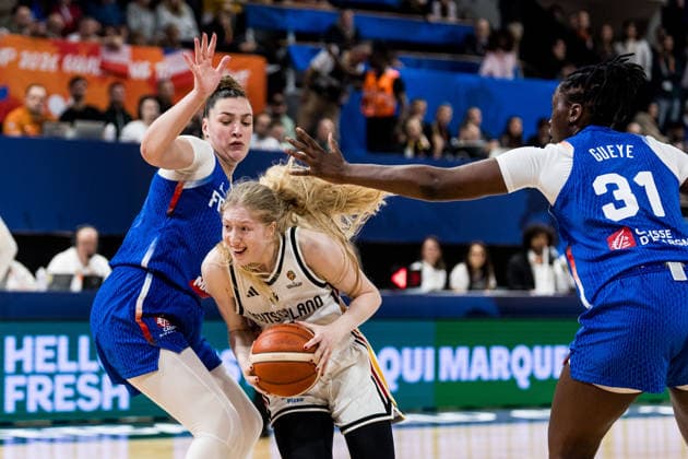 LYON-VILLEURBANNE, FRANCE - MARCH 14: Frieda Buehner (Bühner, Buhner Germany, 20) controls the ball against Alexia Chery (France, 6) and Aminata Gueye (France, 31) during the FIBA Women™s World Cup Qualifying Tournament match between Germany (GER) vs. France (FRA) at Astroballe on matchday 3 of the FIBA Women™s World Cup Qualifying Tournament on March 14, 2026 in Lyon-Villeurbanne, France. France Copyright: xSteffiexWunderlx