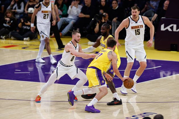 LOS ANGELES, CA - MARCH 14: Los Angeles Lakers guard Luka Doncic (77) uses a Los Angeles Lakers center Deandre Ayton (5) screen during the Denver Nuggets vs Los Angeles Lakers game on March 14, 2026, at Crypto.com Arena in Los Angeles, CA. (Photo by Jevone Moore Icon Sportswire) NBA, Basketball Herren, USA MAR 14 Denver Nuggets at Los Angeles Lakers EDITORIAL USE ONLY Icon20260314013