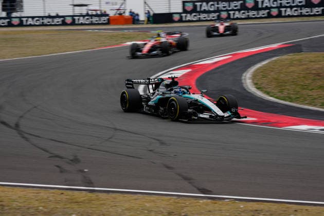 CHINA-MOTORSPORTS F1-SHANGHAI Mercedes™ George Russell followed by Ferrari™s Lewis Hamilton and Ferrari™s Charles Leclerc in action at Shanghai International Circuit during the race at the F1 Chinese Grand Prix, Shanghai, China, March 15, 2026. NEXPHER Peter Li SHANGHAI