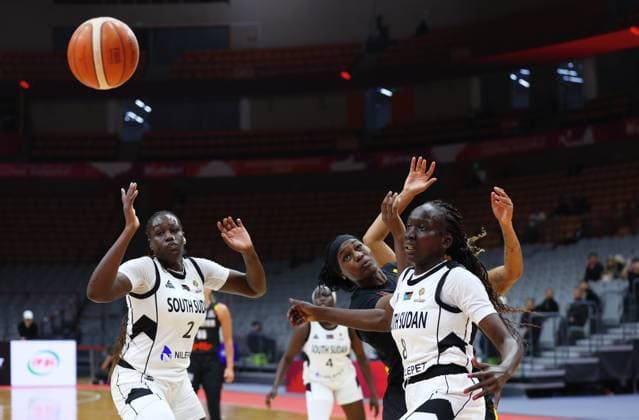 South Sudan s Rose Macuei and Belgium s Bethy Mununga fight for the ball during a basket game between Belgium s national team, Nationalteam Belgian Cats and South Sudan, in Wuhan, China, on Sunday 15 March 2026, the fourth game (out of 5) of the qualifications phase for the World Cup Basket tournament. NIKOLAxKRSTIC  x167535434x